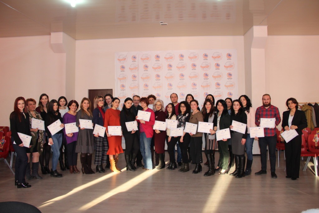Photo of people with certificates